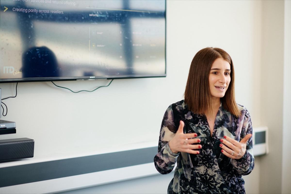 An ITD Global team member presenting carrier pricing
