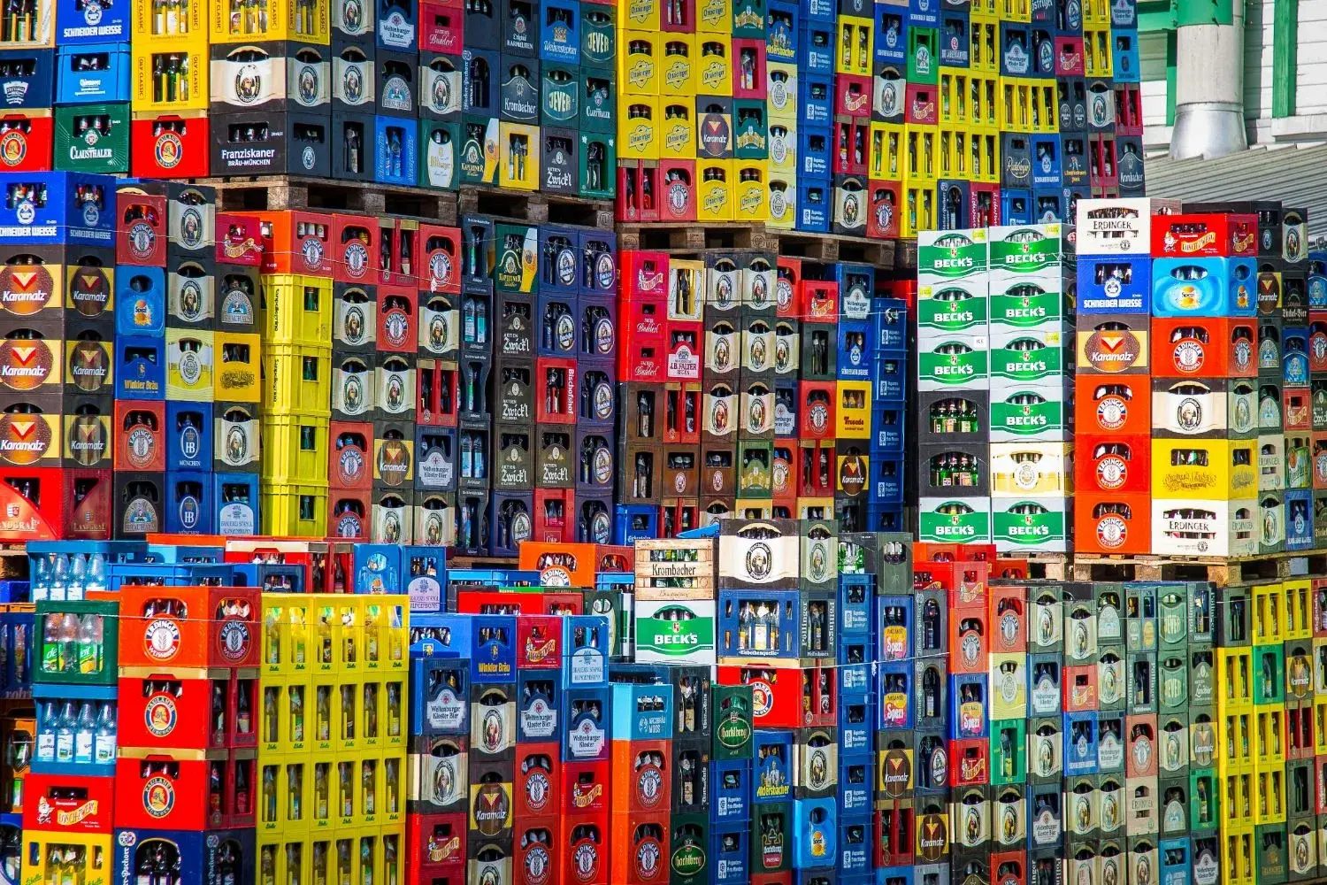 Stacked beverage crates awaiting B2B distribution from a wholesale yard