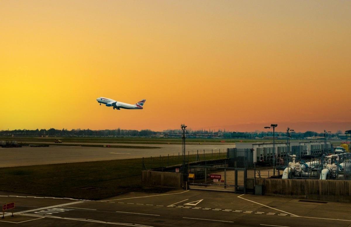 British Airways aircraft taking off at sunset — UK exports