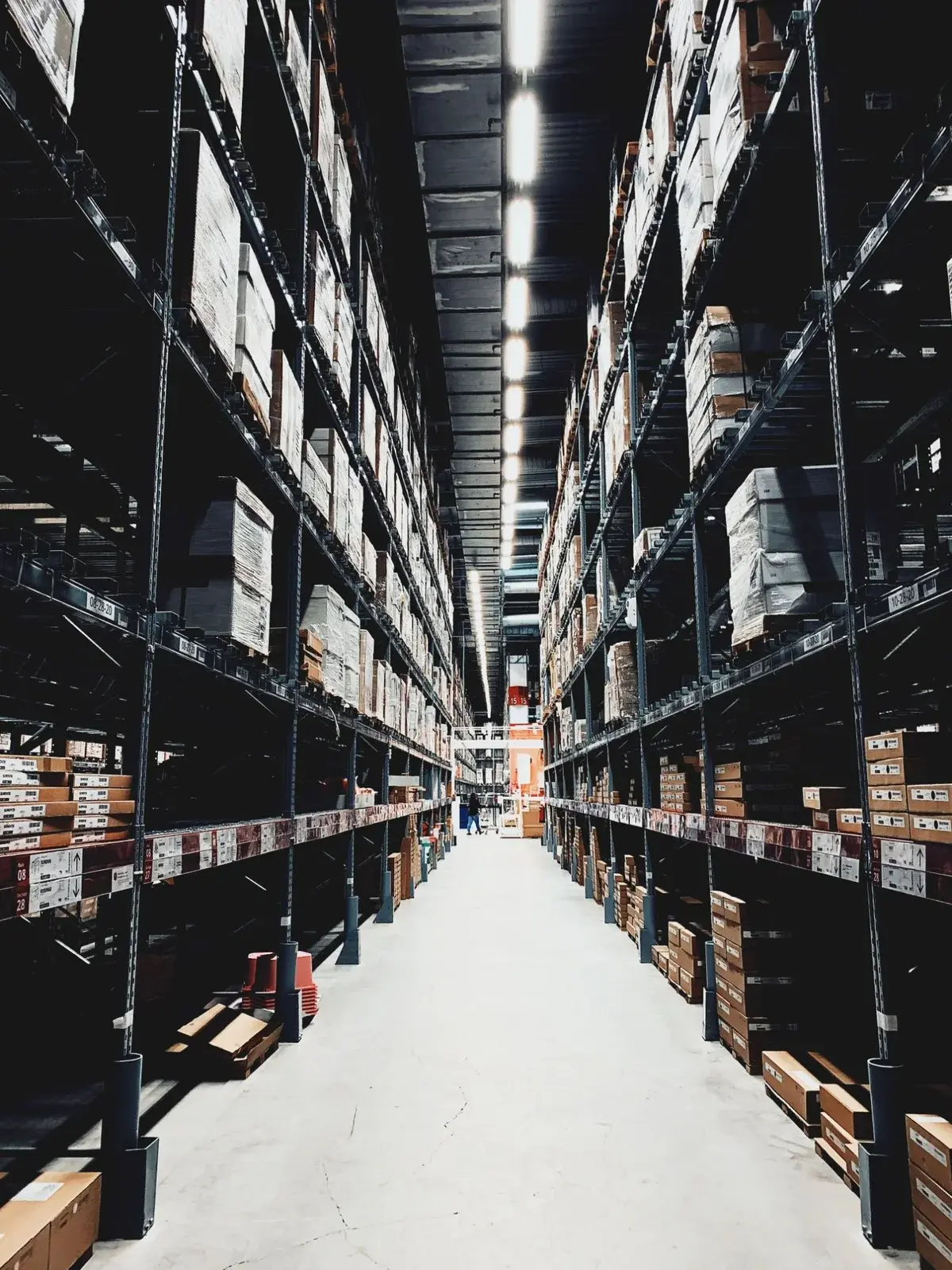 Tall pallet racking aisle in a large distribution warehouse