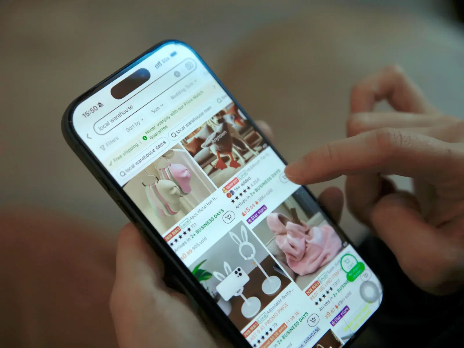 Shopper browsing a marketplace app on a phone — local warehouse listings
