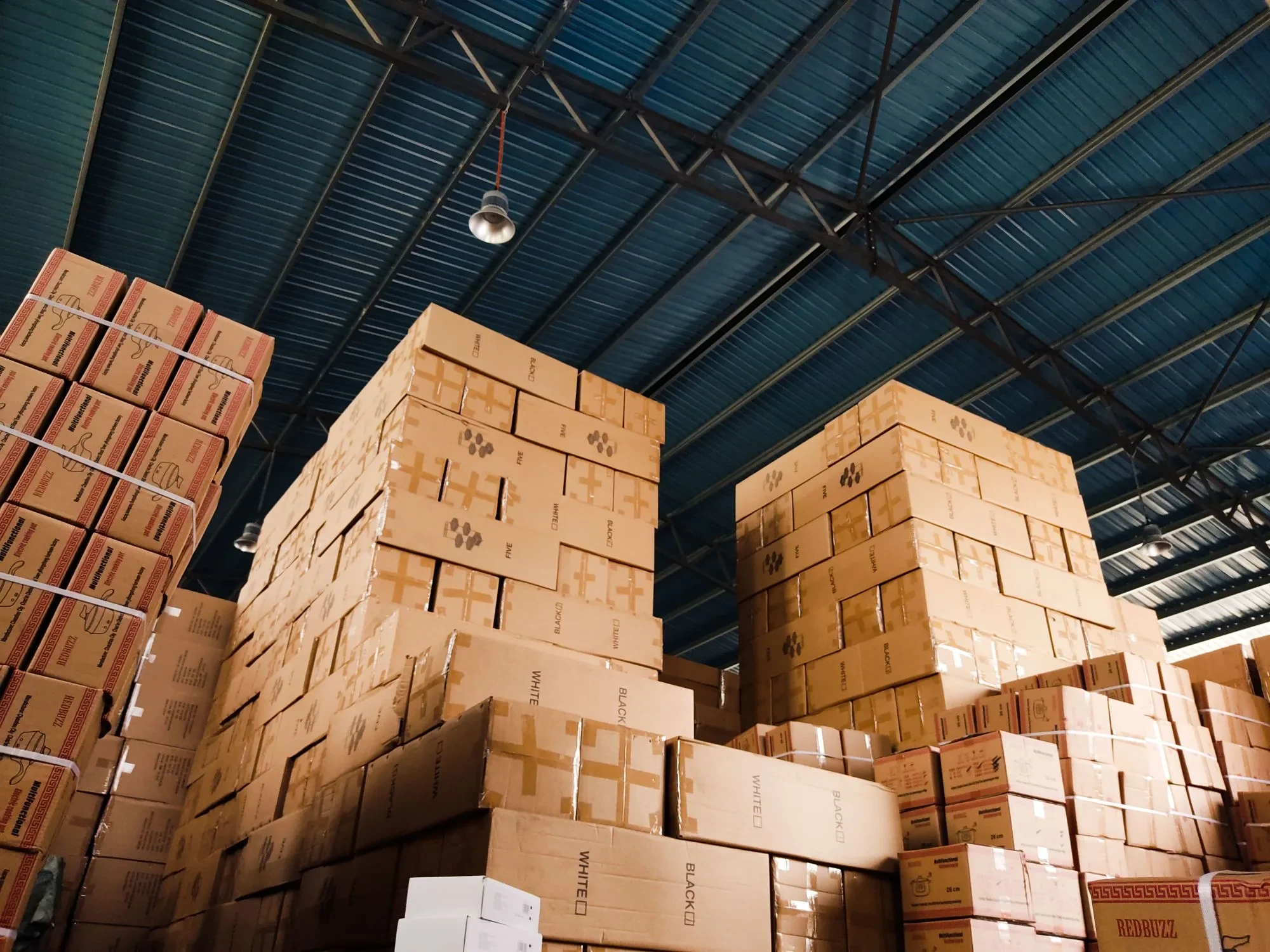 Warehouse stacked with B2B cargo boxes ready for dispatch to business addresses